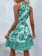 Floral print tie-waist dress in Teal with halter neckline and ruffled hem.
