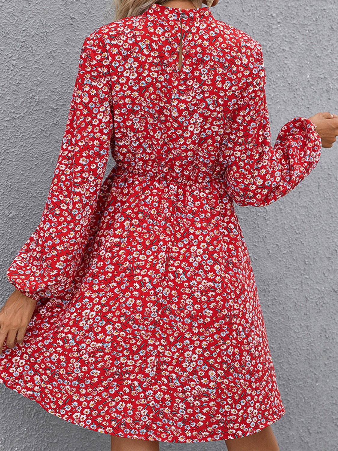 Crimson floral mini dress with gathered sleeves and high neckline.