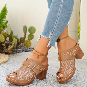 Tan buckle-embellished mid heel sandals with white floral embroidery and peep toe.