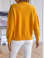 Gold button-down cardigan with ribbed cuffs and hem, crew neck, long sleeves.