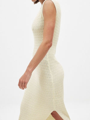 Sleeveless yellow knit midi dress with side slit and scoop neck.