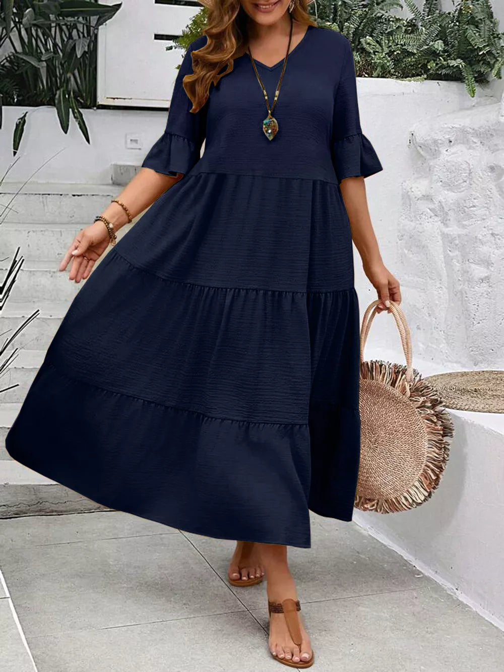 Navy blue tiered midi dress with ruffle sleeves and v-neck