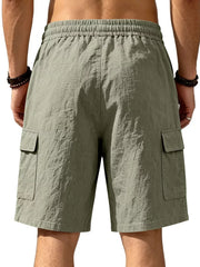 Military green cargo shorts with drawstring waist and crinkled texture.