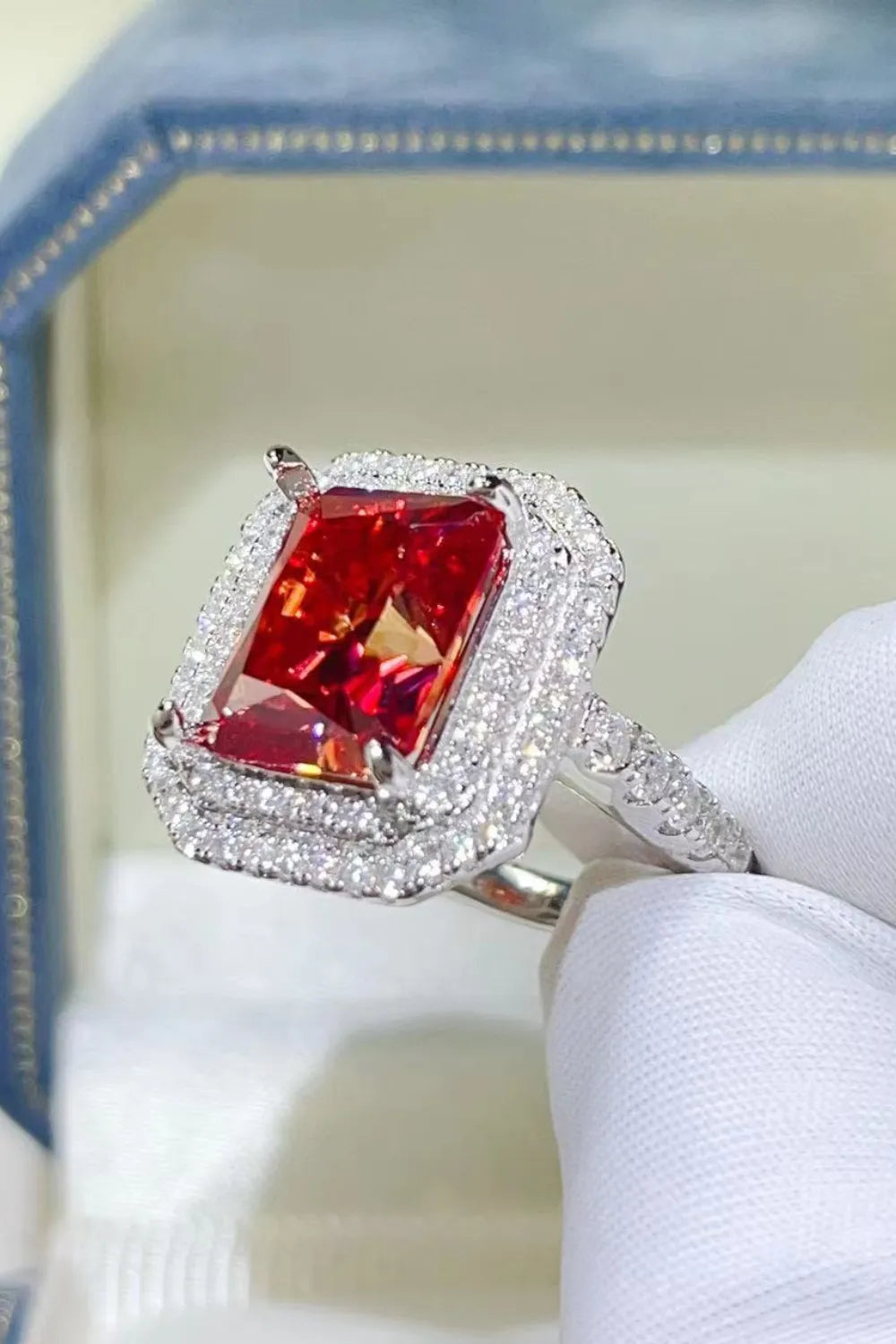 Radiant Ruby Halo Cocktail Ring in sterling silver with a large, faceted scarlet center stone surrounded by a double halo of