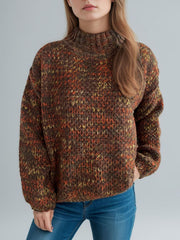 Textured mélange mock neck sweater in brown with orange and yellow flecks, acrylic knit.