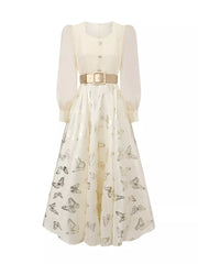 Apricot midi dress with butterfly print, cinched waist, and button-down front.