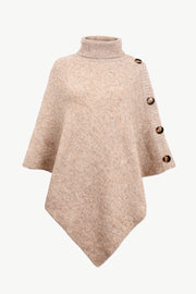 Tan knit poncho with turtleneck and button details on the side.
