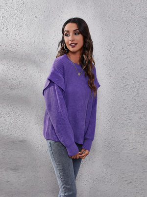 Purple ribbed knit pullover sweater with ruffled sleeves and crew neck.