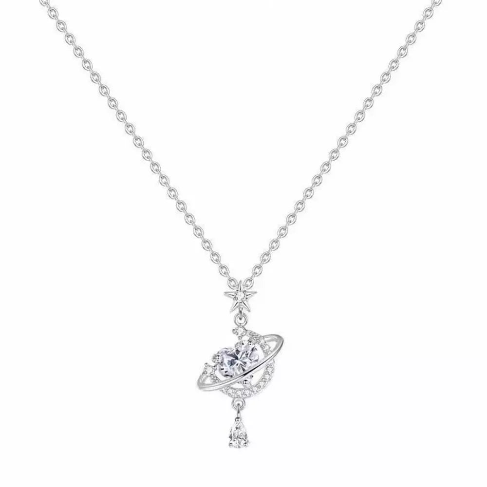 Silver celestial heart pendant necklace with planet and star details.