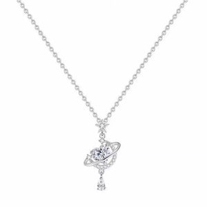 Silver celestial heart pendant necklace with planet and star details.