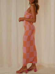 Geometric knit maxi slip dress in orange and dusty pink checkerboard pattern.