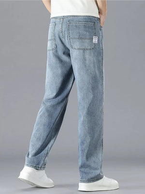 Men's light blue cotton straight leg jeans with classic five-pocket styling.