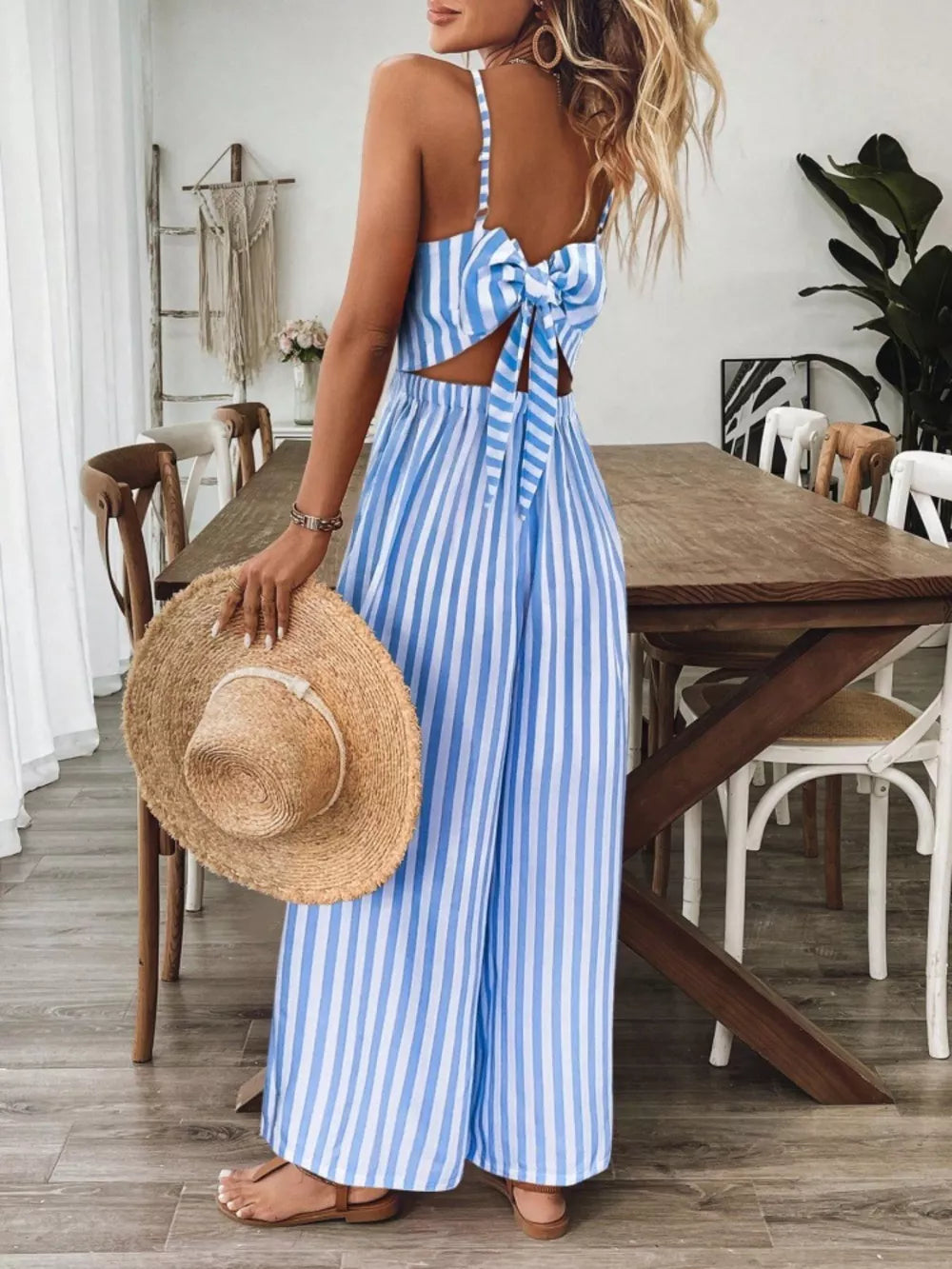 Light blue striped backless wide-leg jumpsuit with bow detail
