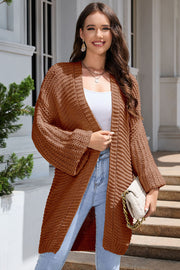 Textured knit cocoon cardigan in camel with balloon sleeves and open front.