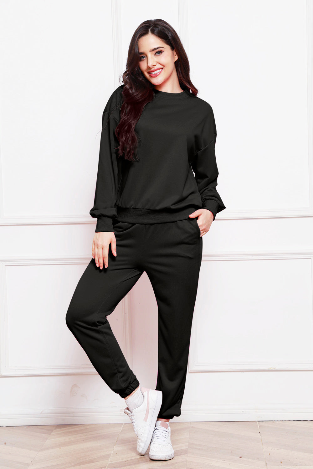 Black relaxed fit loungewear set with crewneck sweatshirt and jogger pants.