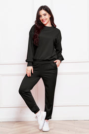 Black relaxed fit loungewear set with crewneck sweatshirt and jogger pants.