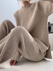 Asymmetric ribbed knit co-ord set in Dust Storm acrylic, with mock neck sweater and wide leg pants.