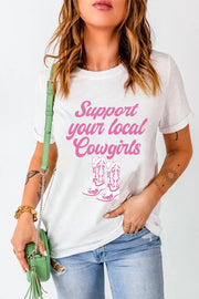 White graphic tee with rolled sleeves and pink cowgirl boot print and text.