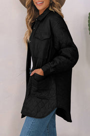 Black quilted utility jacket with button-flap chest pockets and side pockets.