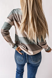 Ribbed stripe long sleeve top in neutral tones with patch pocket detail.