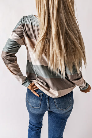 Ribbed stripe long sleeve top in neutral tones with patch pocket detail.