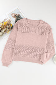 Dusty pink perforated knit v-neck pullover sweater with open knit details and ribbed cuffs.