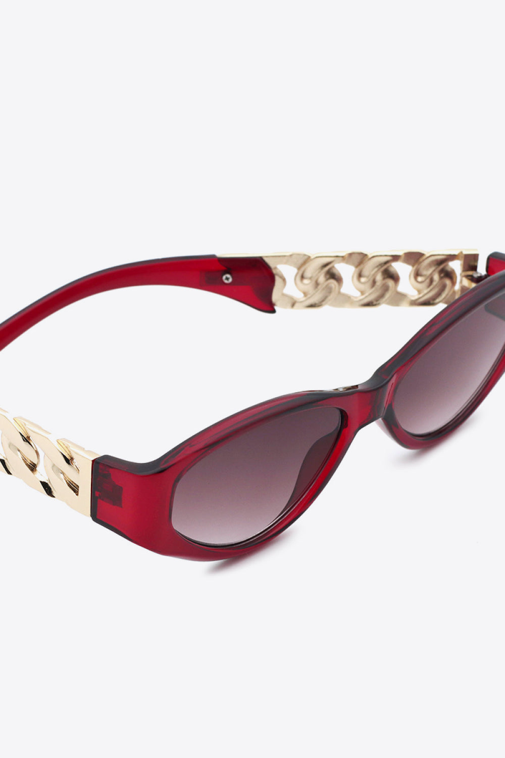 Deep Red cat-eye sunglasses with gold chain detail on temples.