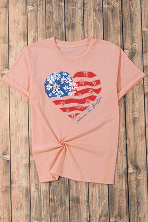 Peach t-shirt with floral American flag heart graphic and text.