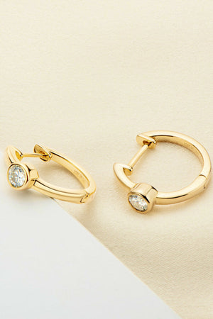 Gold bezel-set sparkle huggie hoop earrings with clear stones