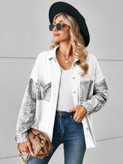 White denim overshirt with leopard print sleeves and pockets, buttoned front.