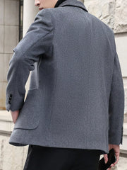 Men's grey lapel collar blazer with buttoned cuffs and flap pockets.