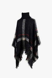 Black plaid turtleneck cape with fringe detail and textured acrylic knit.