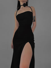 Black backless bodycon maxi dress with high slit and crisscross straps.