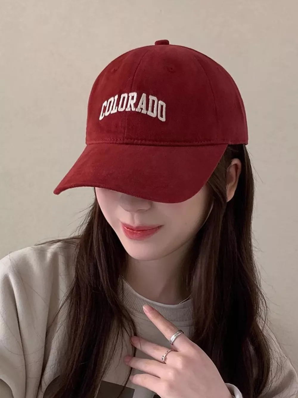 Burgundy cotton baseball cap with embroidered Colorado text.