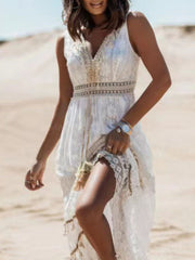 White lace V-neck maxi dress with embroidered waist detail and lace trim.