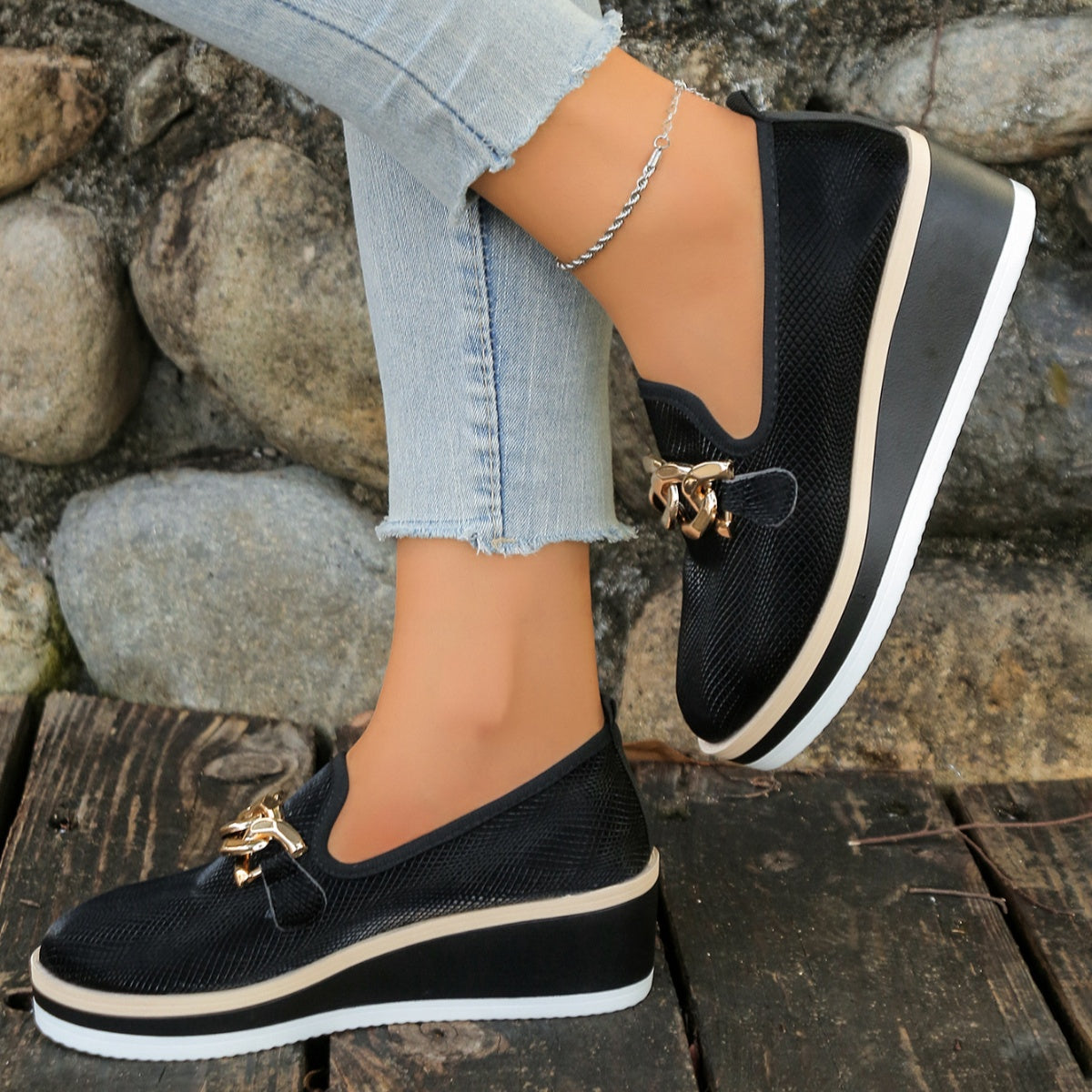 Black chain decor wedge loafers with comfortable platform sole.