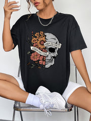 Black oversized tee with skull and floral graphic, featuring text "Kinda Emotional Kinda Emotionless".