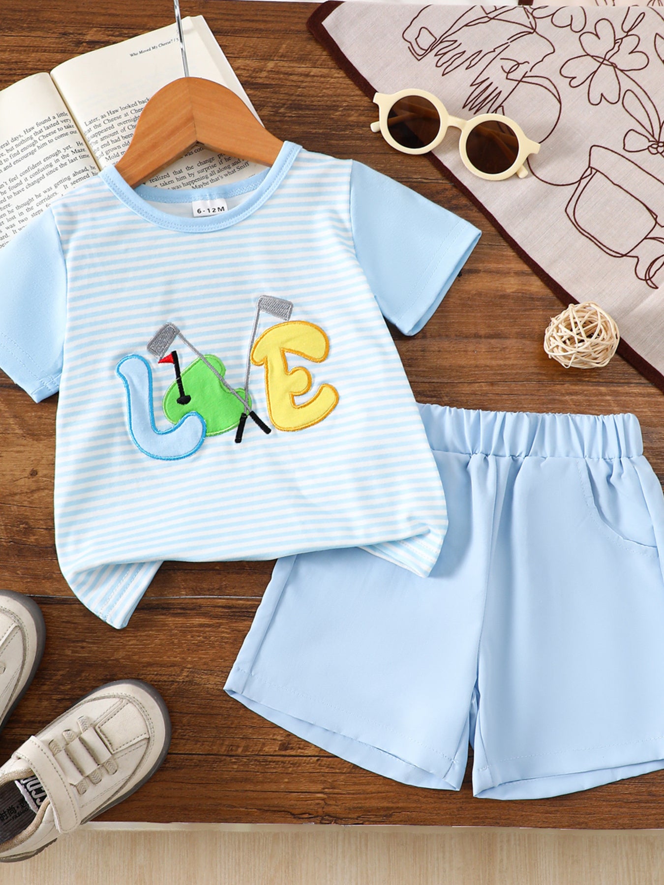 Baby boys' light blue striped tee with embroidered golf "LOVE" graphic and matching shorts.