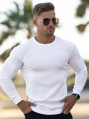 White ribbed knit crewneck long sleeve muscle fit top with crew neckline.