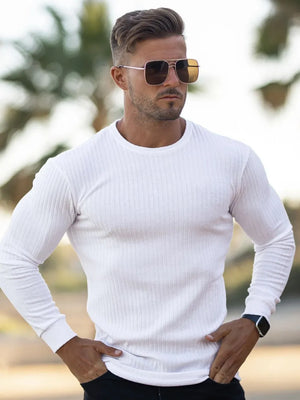 White ribbed knit crewneck long sleeve muscle fit top with crew neckline.