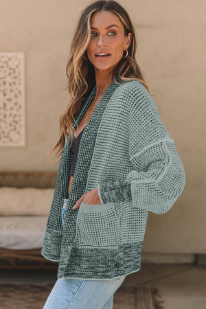 Textured open-front knit cardigan in gum leaf with pockets and a relaxed fit.