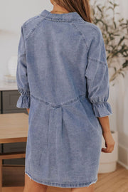 Light blue denim shirtdress with ruffled cuffs and A-line cut.