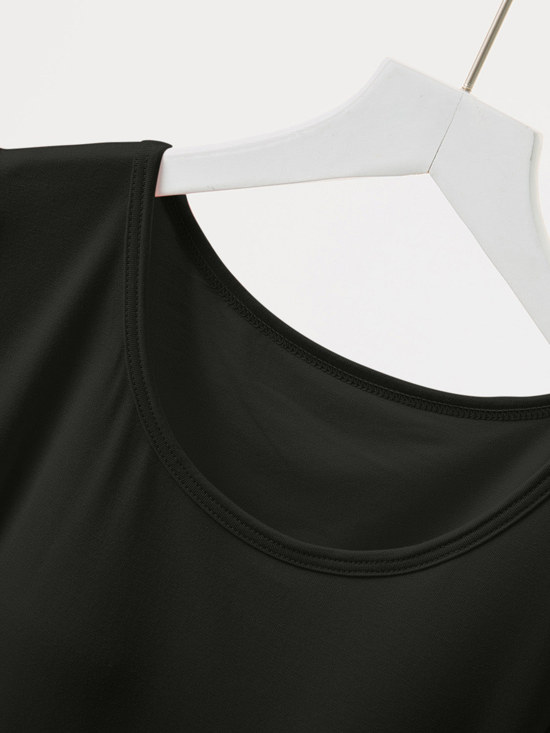 Black built-in bralette tee with a scoop neckline and double-stitched trim.