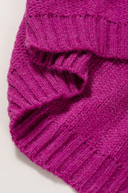 Colorblock ribbed knit pullover in magenta acrylic with a textured pattern.