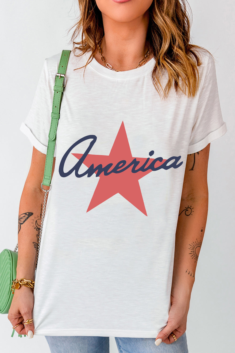 White crew neck t-shirt with red star and blue America graphic.