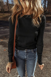 Black crewneck long sleeve knit top with a fitted silhouette.