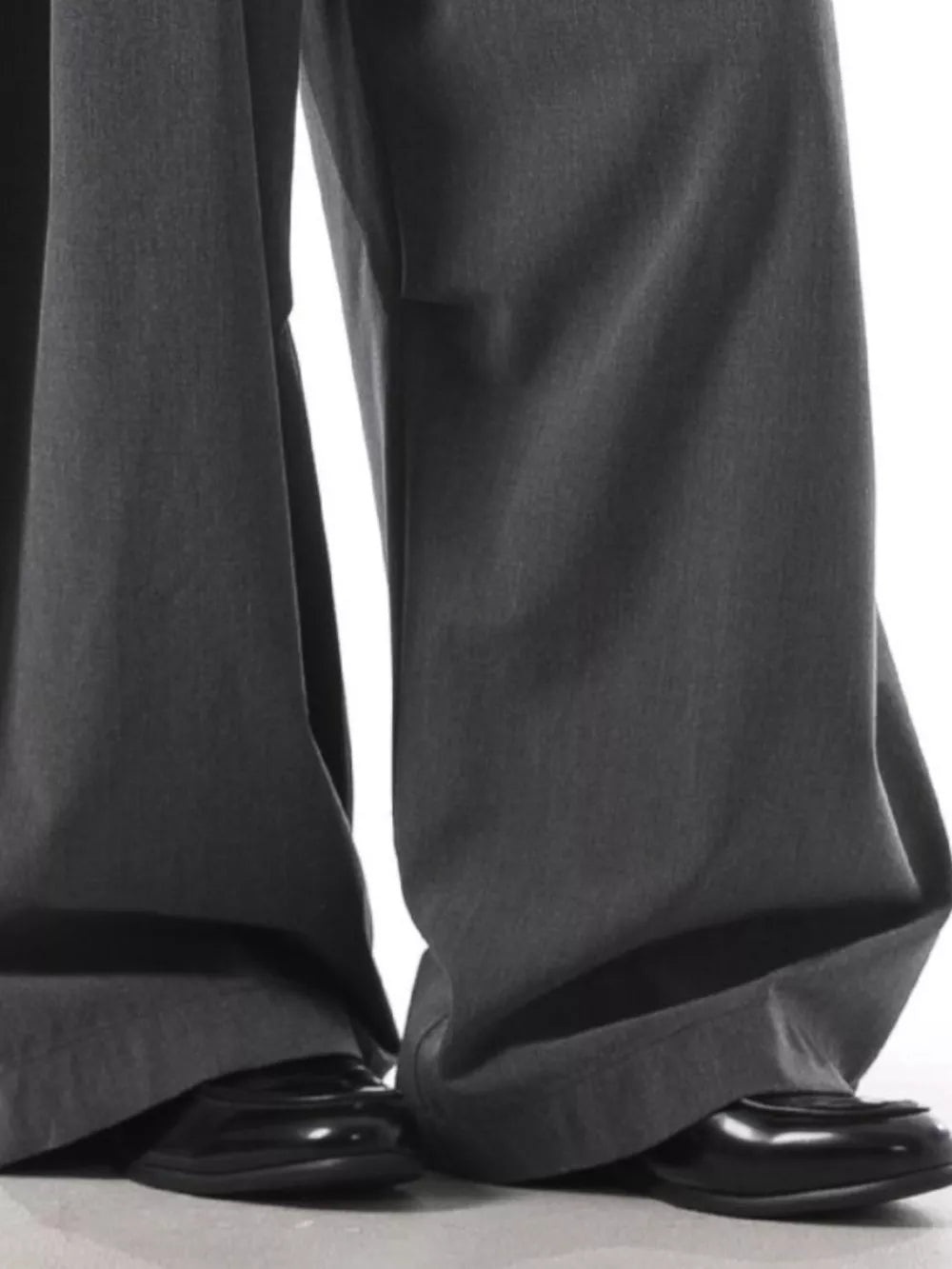 Men's charcoal wide leg sweatpants with a relaxed fit, paired with black dress shoes.