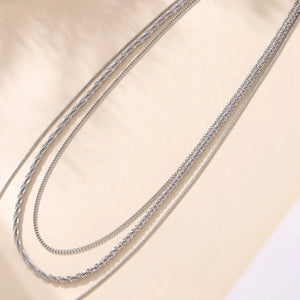 Delicate three-strand silver crystal necklace with layered chains
