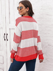 Striped knit crewneck sweater in red and white with ribbed trim.