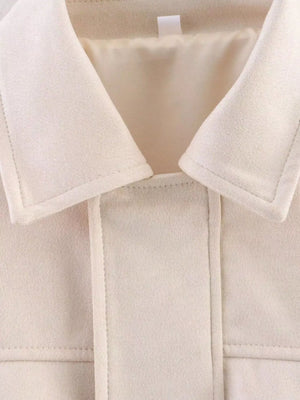 Oversized off-white zip-up jacket with collar detail and visible stitching.